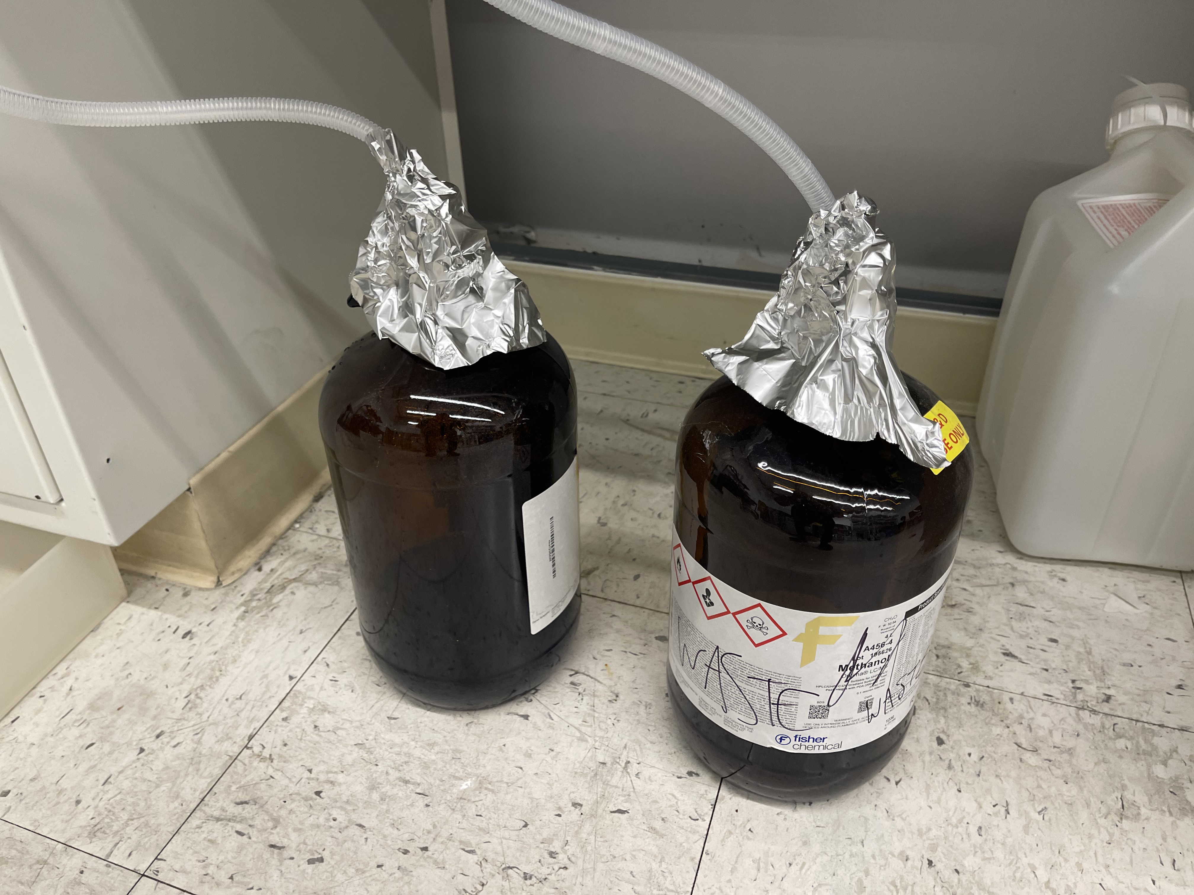 loosely covered open waste container